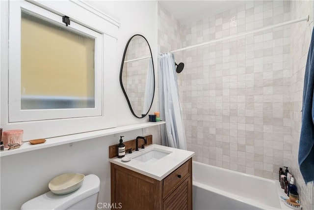 full bathroom with vanity, toilet, and shower / tub combo