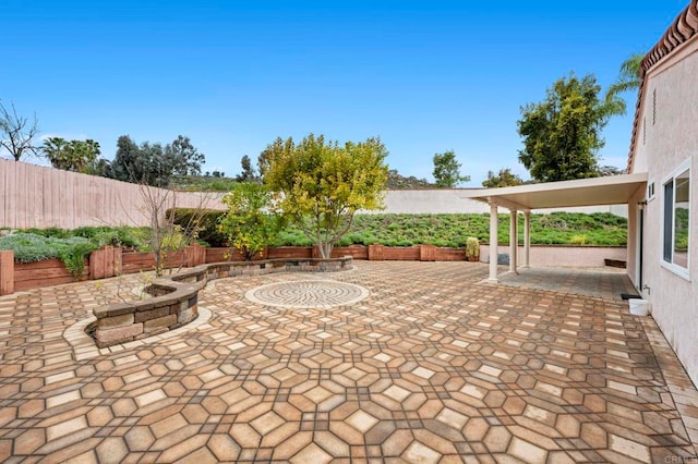 view of patio / terrace featuring a fenced backyard and an outdoor fire pit