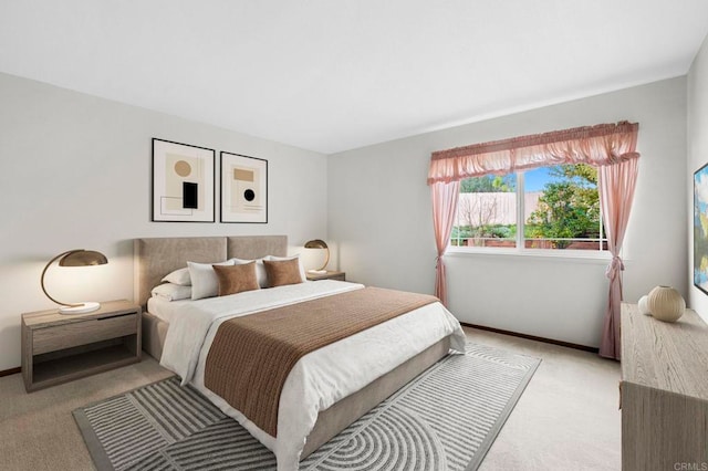 bedroom with light colored carpet