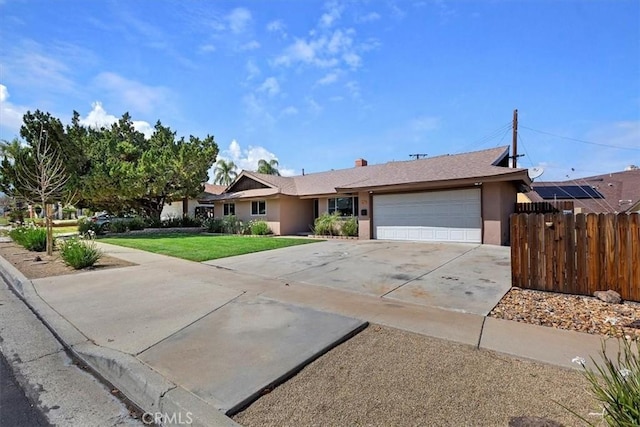 ranch-style house featuring stucco siding, a front lawn, driveway, fence, and an attached garage