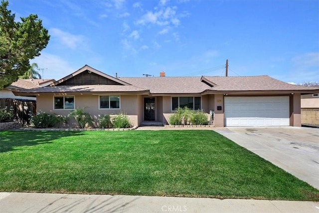 ranch-style home featuring stucco siding, a garage, concrete driveway, and a front yard