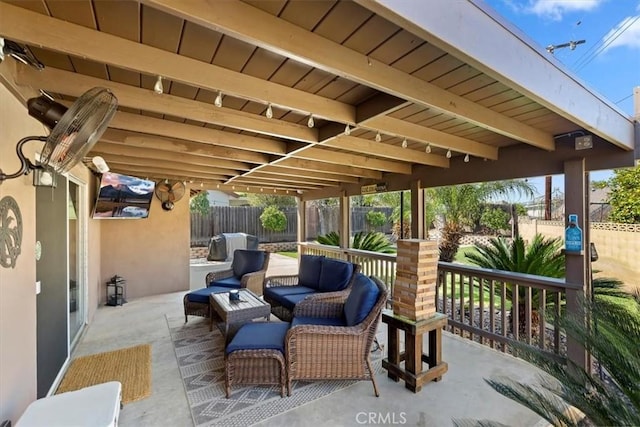 view of patio / terrace featuring an outdoor hangout area and fence