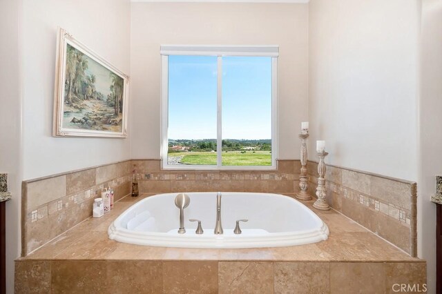 full bathroom with a bath