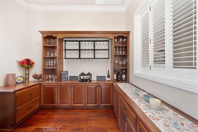 bar featuring a dry bar, visible vents, dark wood-style flooring, and ornamental molding