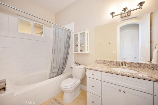 full bathroom featuring tile patterned floors, toilet, vanity, and shower / bath combo