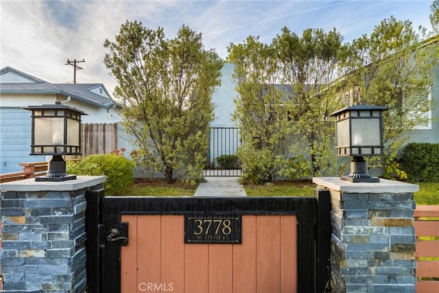 view of gate featuring fence