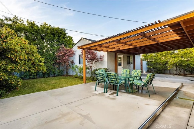 view of patio featuring outdoor dining space, a pergola, and fence