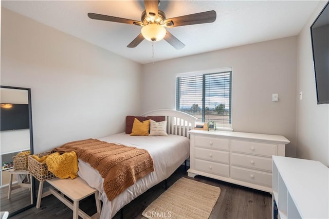 bedroom featuring ceiling fan and dark wood finished floors