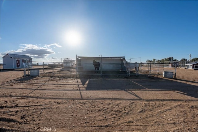 exterior space featuring a rural view and fence