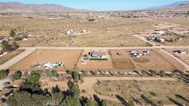 aerial view featuring a rural view, a mountain view, and a desert view