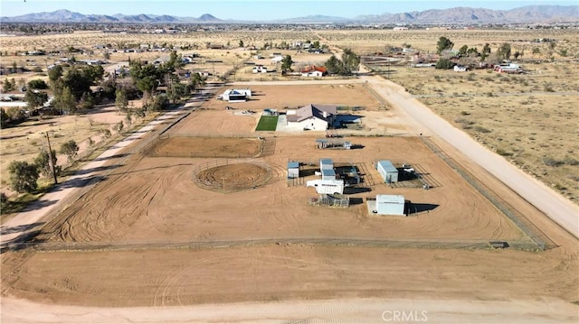 bird's eye view featuring a mountain view, a rural view, and view of desert