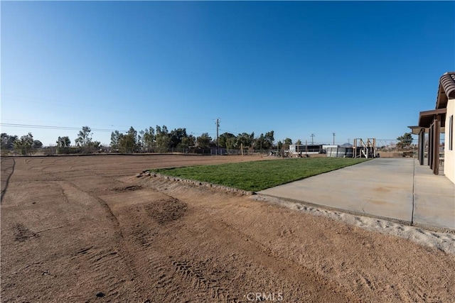 view of road with concrete driveway