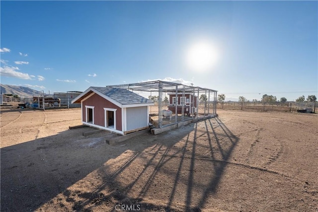 view of poultry coop featuring fence