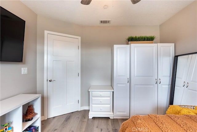 bedroom with visible vents and light wood-style floors