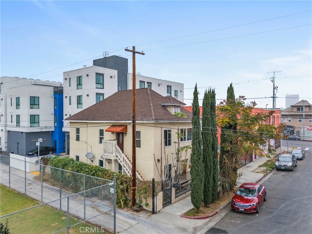 view of building exterior with fence