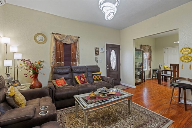 living room featuring baseboards and wood finished floors