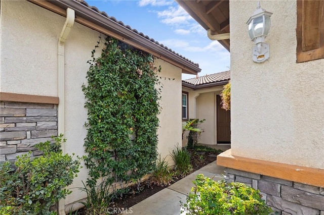 view of side of property featuring stucco siding