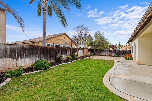 view of yard featuring a patio area and a fenced backyard