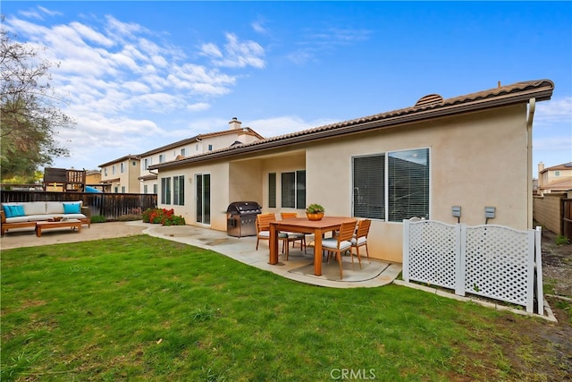 back of property with outdoor lounge area, a patio, fence, and stucco siding