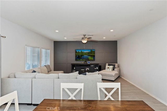 living room featuring recessed lighting, baseboards, light wood-style floors, and a ceiling fan