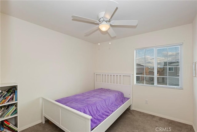 bedroom featuring carpet flooring, a ceiling fan, and baseboards