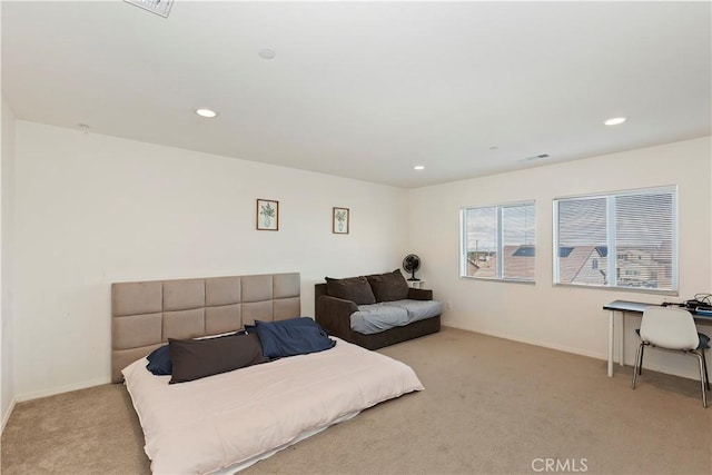 bedroom with recessed lighting, visible vents, light carpet, and baseboards