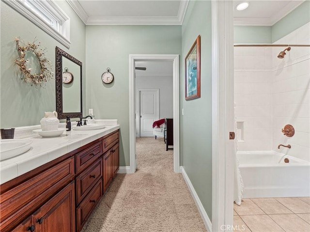 bathroom featuring tile patterned floors, shower / bathing tub combination, crown molding, double vanity, and baseboards