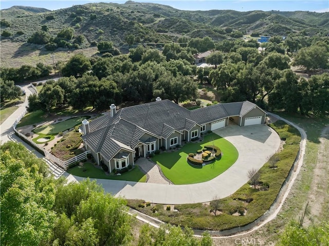 birds eye view of property with a mountain view