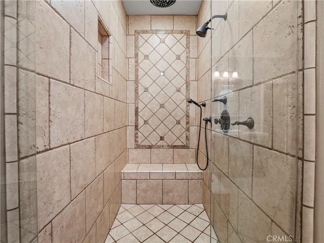 full bathroom with tiled shower