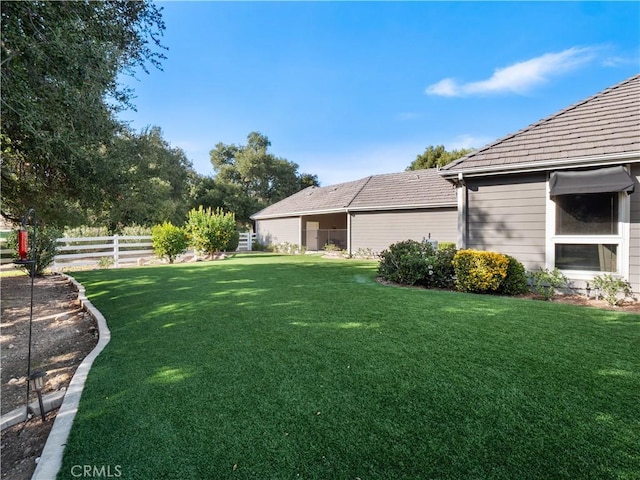 view of yard featuring fence