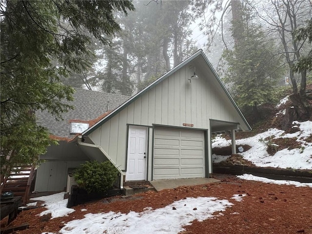 view of snow covered garage