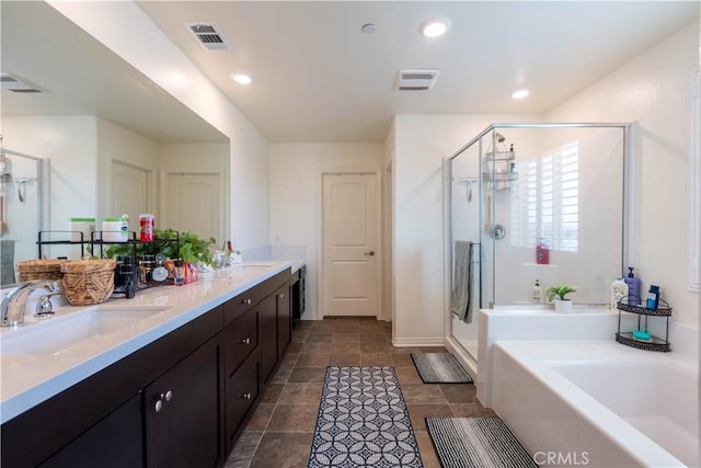 6594 June Mountain Way, Jurupa Valley, CA 92509 - bathroom with visible vents, a shower stall, a garden tub, and a sink