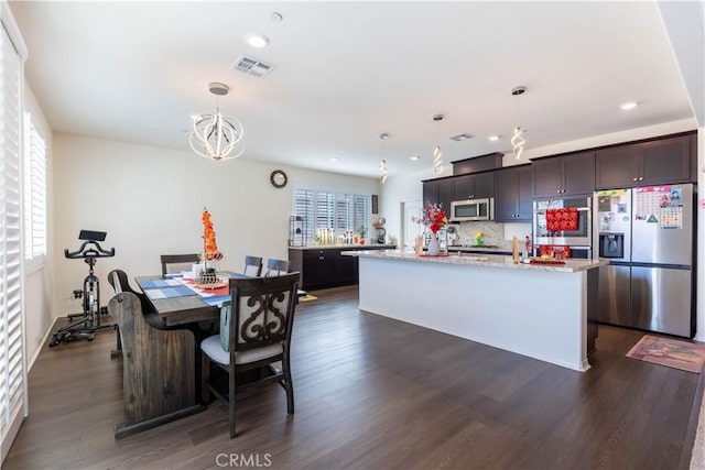 6594 June Mountain Way, Jurupa Valley, CA 92509 - dining room with recessed lighting, visible vents, dark wood finished floors, and a chandelier