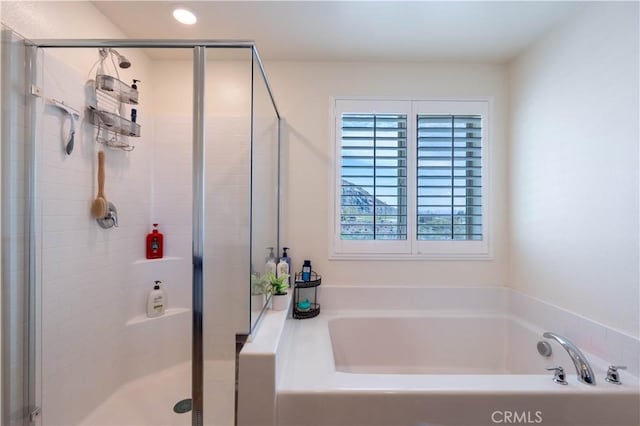 6594 June Mountain Way, Jurupa Valley, CA 92509 - bathroom with a bath, recessed lighting, and a stall shower