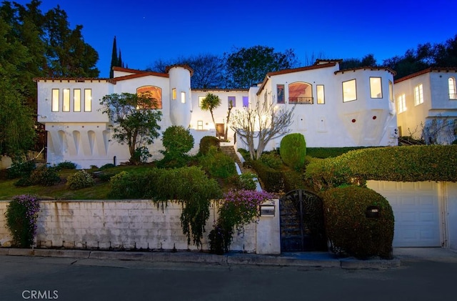 mediterranean / spanish house with stucco siding