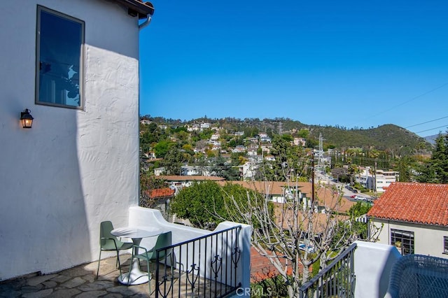 balcony featuring a mountain view