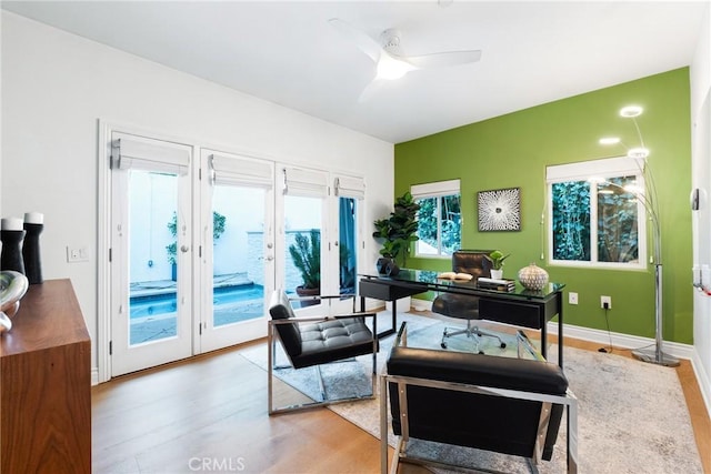 office featuring french doors, baseboards, a ceiling fan, and wood finished floors