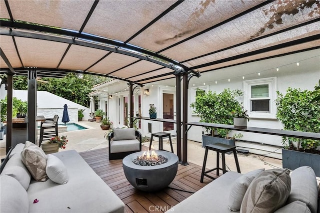 wooden deck featuring an outdoor pool, fence, an outdoor living space with a fire pit, and a pergola