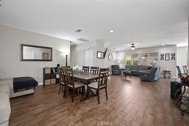 dining space with recessed lighting, wood finished floors, visible vents, and baseboards