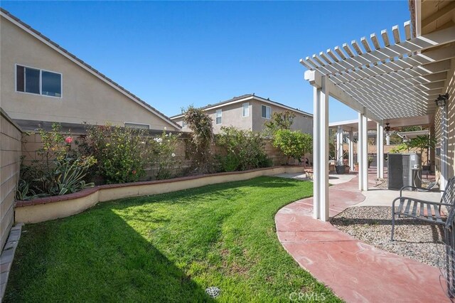 view of yard with a patio area, a pergola, and a fenced backyard