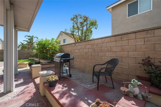 view of patio featuring area for grilling and a fenced backyard