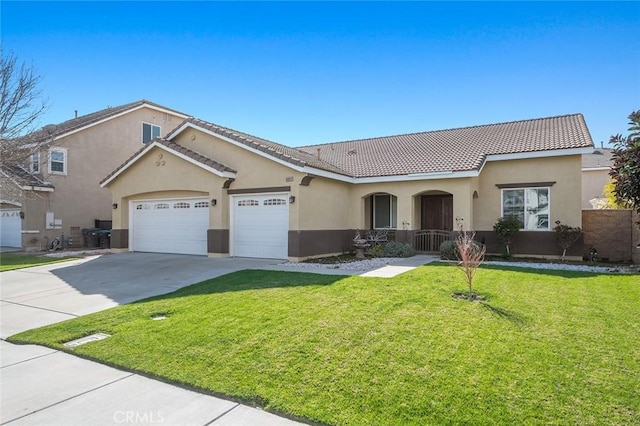 view of front of house featuring stucco siding, concrete driveway, a front yard, an attached garage, and a tiled roof