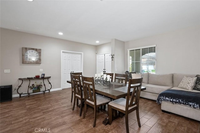 dining room with recessed lighting, wood finished floors, and baseboards