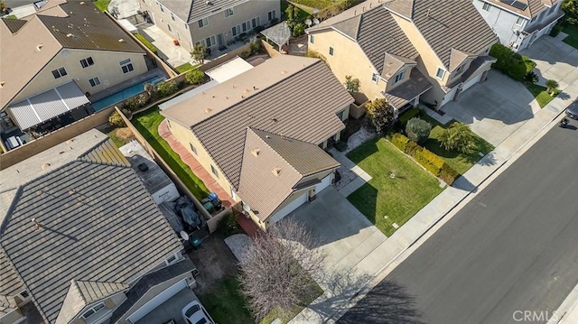 birds eye view of property with a residential view