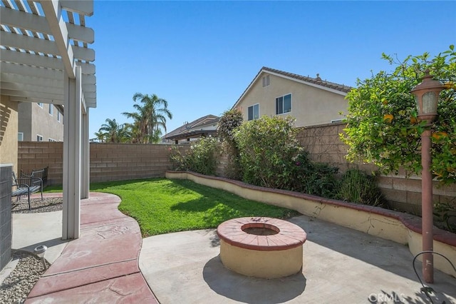 view of patio / terrace featuring a fire pit, a fenced backyard, and a pergola