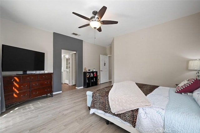 bedroom with visible vents, ceiling fan, baseboards, and light wood-style floors