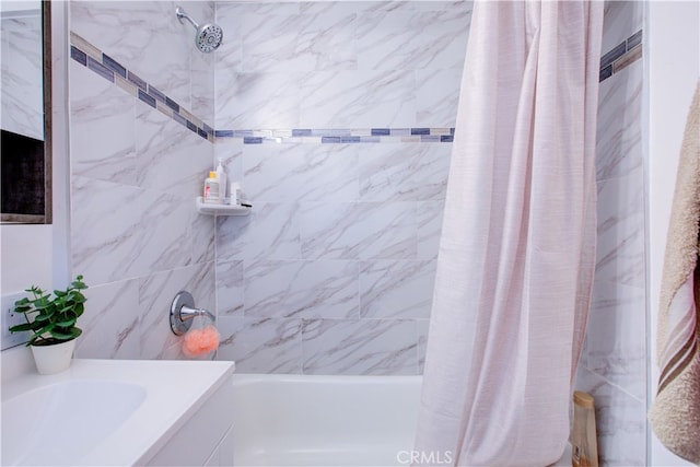 full bathroom featuring vanity and shower / bath combo with shower curtain