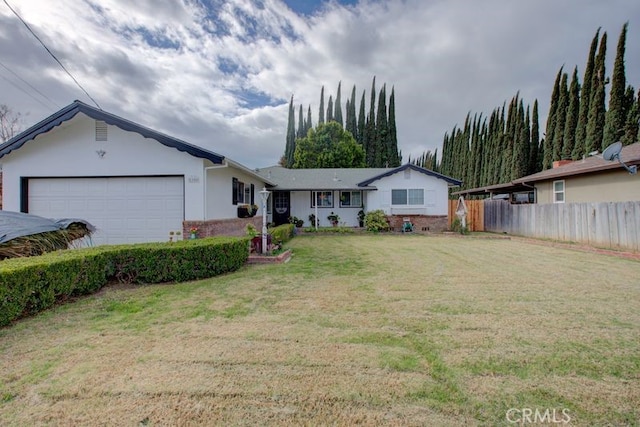 single story home featuring a front yard, an attached garage, fence, and stucco siding