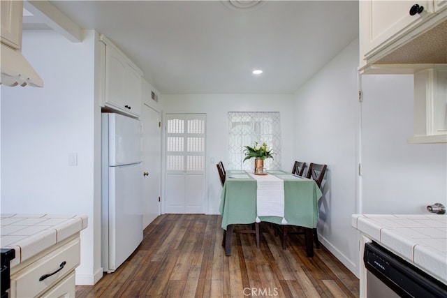 dining area with recessed lighting, visible vents, baseboards, and dark wood finished floors