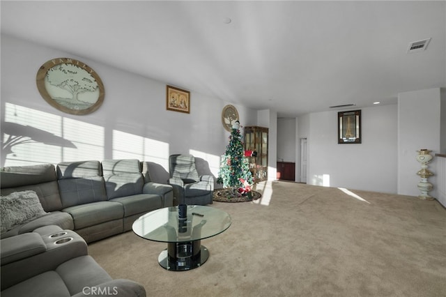 living room featuring visible vents and carpet floors